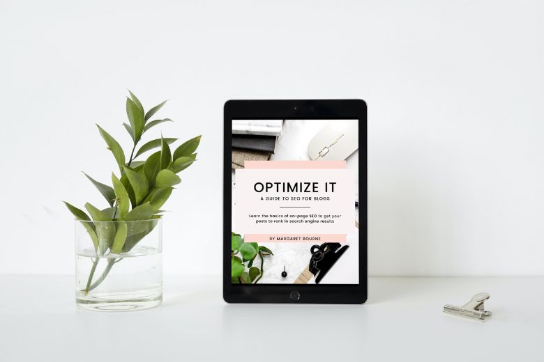The front cover of the Optimize It: SEO For Blogs ebook cover on an iPad.