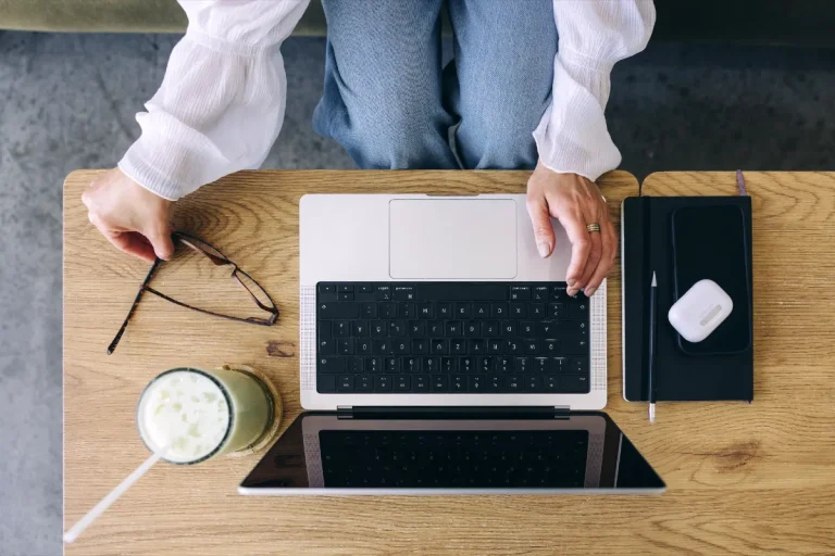 How Many Posts Should You Have Before You Launch Your Blog? The Surprising Answer 1 Faceless woman using a laptop - how many blog posts do you need before you launch.