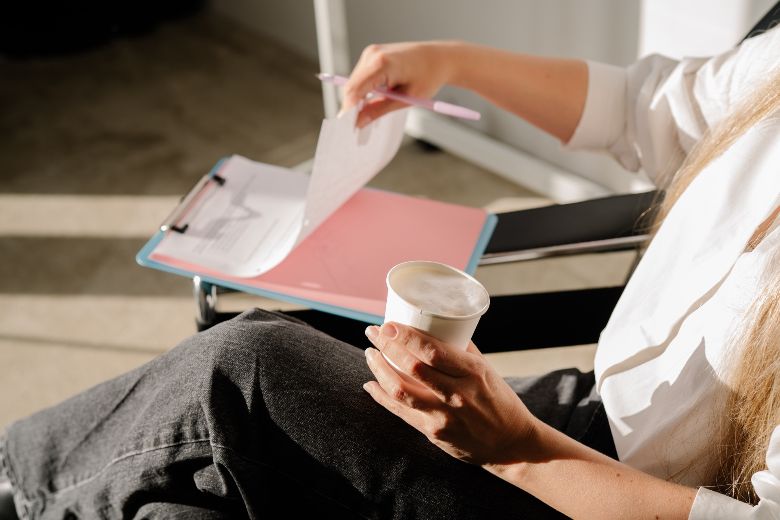 Why It's Perfectly OK To Take A Break From Blogging & How To Not Lose Momentum 2 Faceless woman sipping on coffee and writing notes - taking a blogging break with insights from blogging strategist Margaret Bourne.