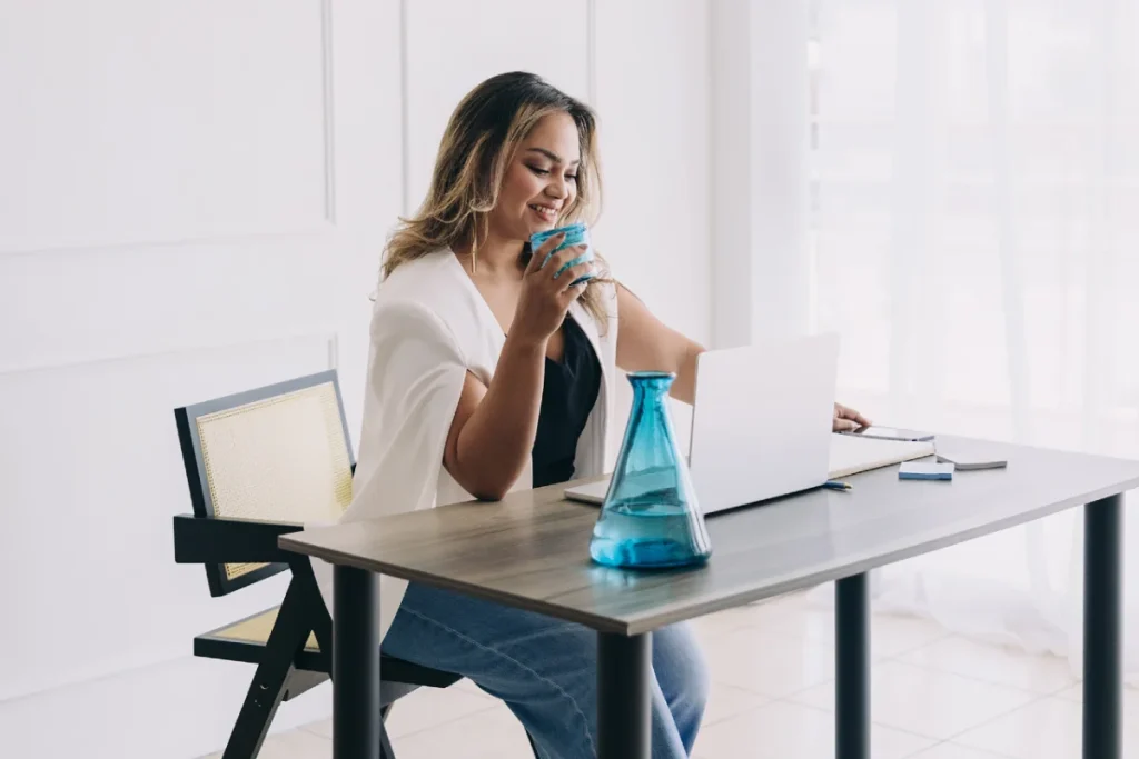 6 Reasons Why You Need An Email List & How To Start Building It in 2026 1 Woman siting at a desk with a laptop - why you need an email list.