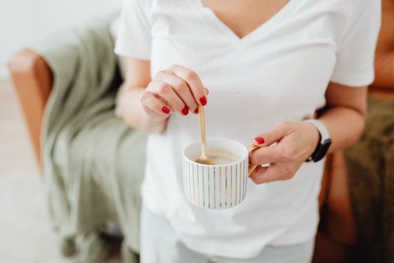 Woman with coffee cup - coffee for bloggers.