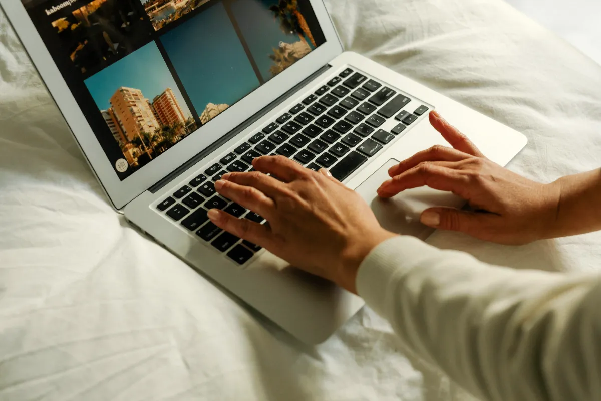 Blog Content Planning and Structure Organizing in 3 Easy Steps 4 Faceless person using a laptop for blog content planning - with Margaret Bourne, blog strategist.