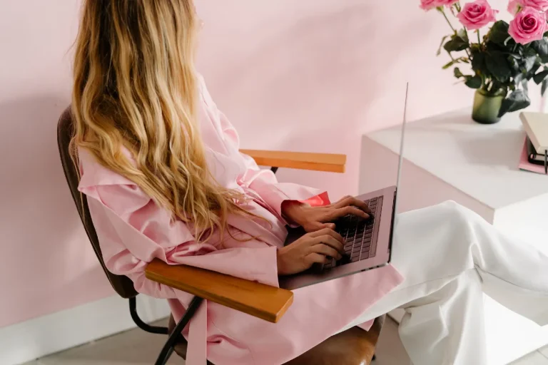 How To Write Your First Blog Post: A smart Strategy That Wows Readers 5 Faceless woman using a laptop - how to write your first blog post.