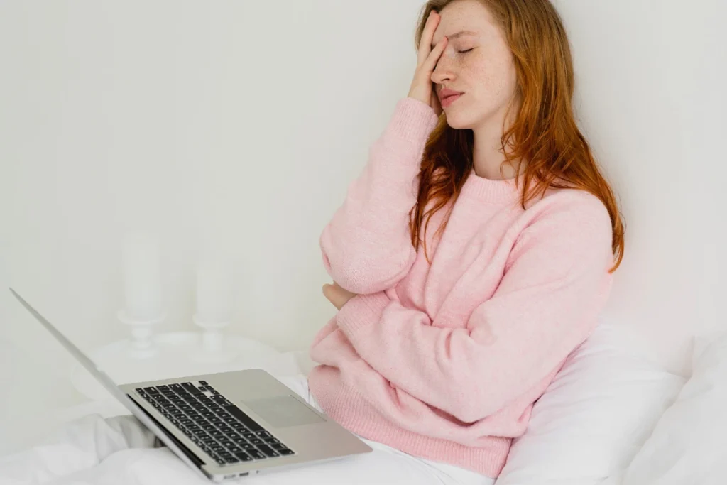 10 Common WordPress Mistakes New Bloggers Make & How To Avoid Them 1 Frustrated woman with a laptop - common mistakes bloggers make.