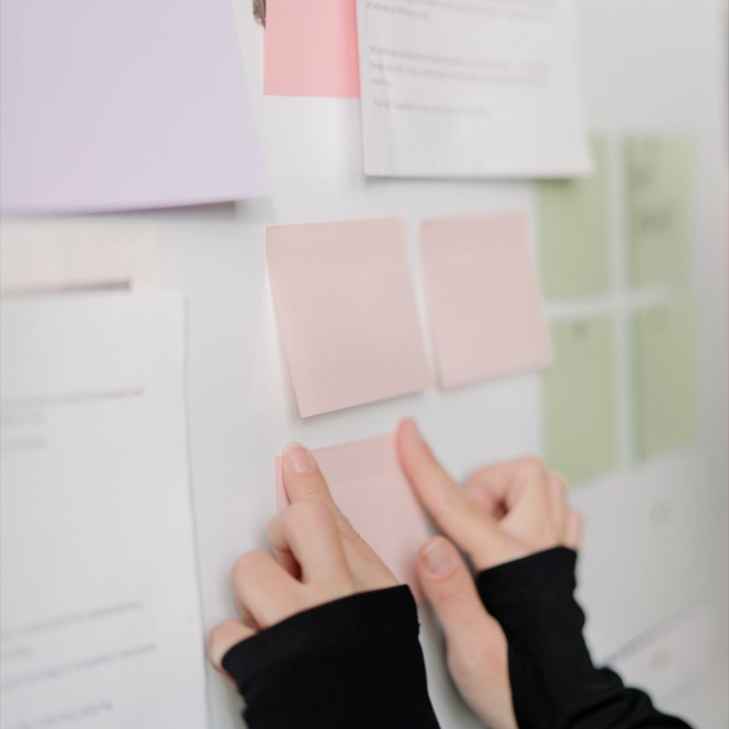 Grow It Blog Foundation Course 2 Faceless woman placing notes on a board - Grow It course for blog foundations from Margaret Bourne.